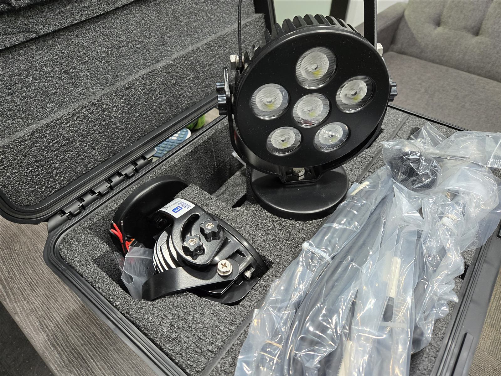Kitted LED work light assembly staged in a hard case